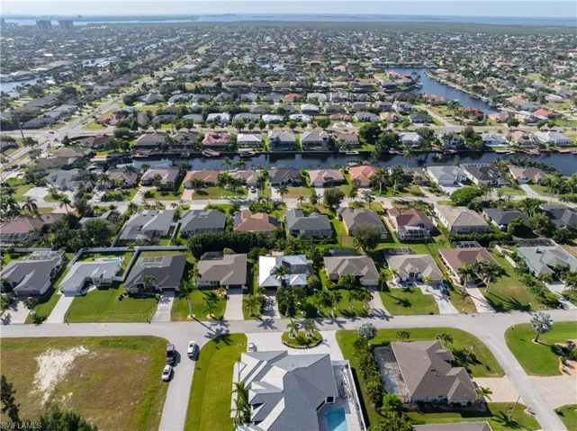 View of property location with nearby canal and suburban area
