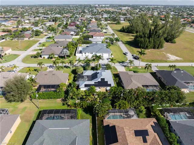 Aerial view of property's location featuring nearby suburban area