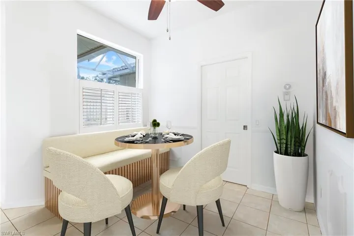 Dining Nook In Kitchen With French Door to Laundry Room and Garage in Background