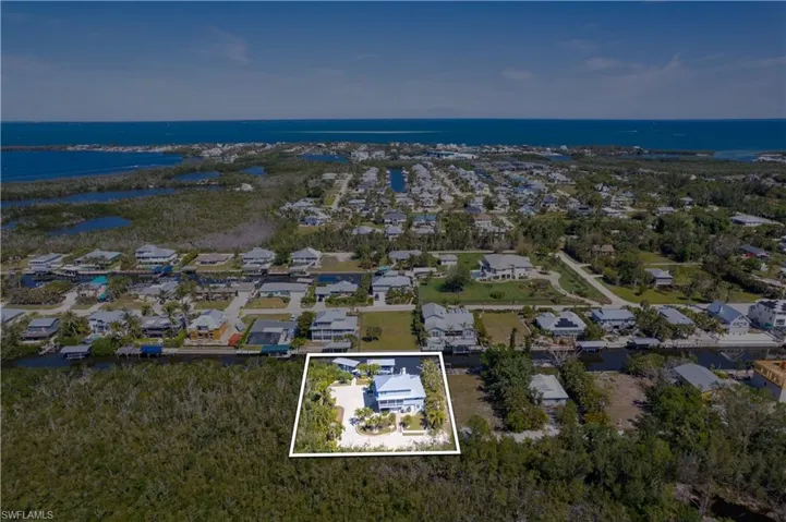 Aerial view featuring a water view and a residential view
