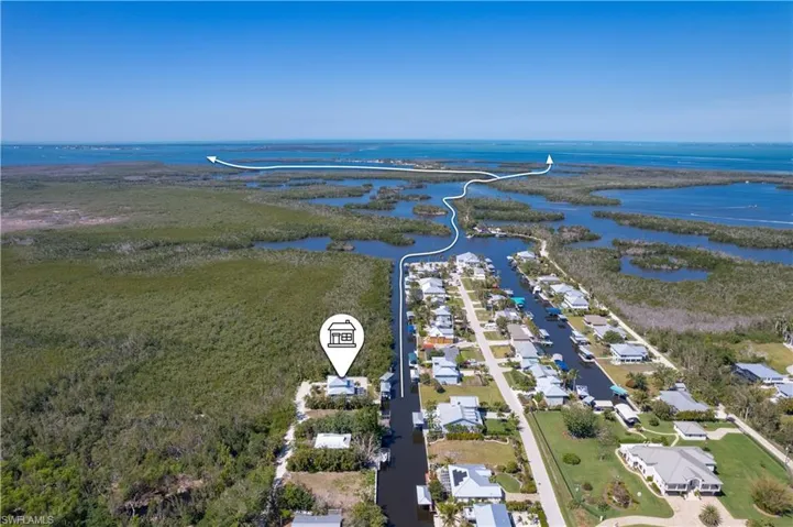 Drone / aerial view with a residential view and a water view