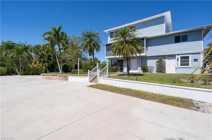 View of property's community featuring a yard