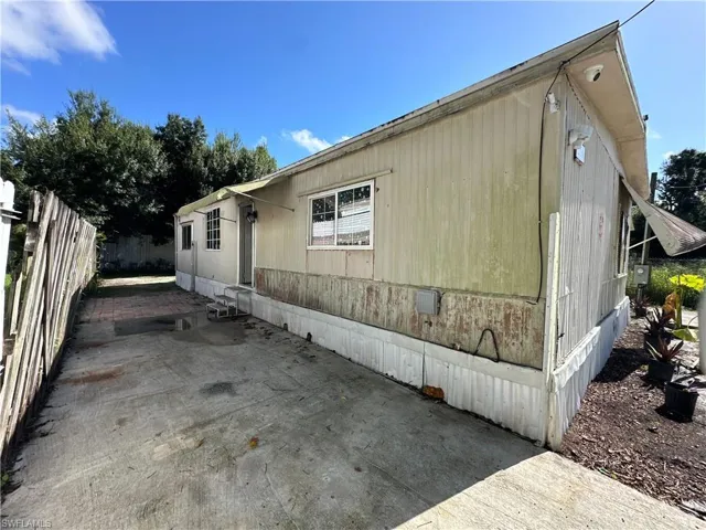 View of side of home featuring a patio