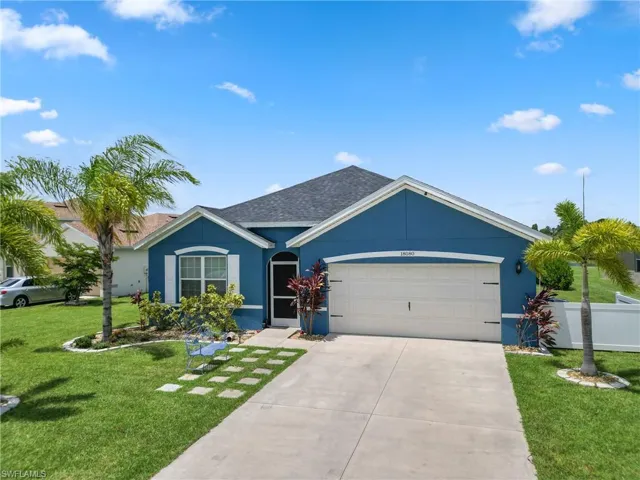 Ranch-style home with a garage and a front yard