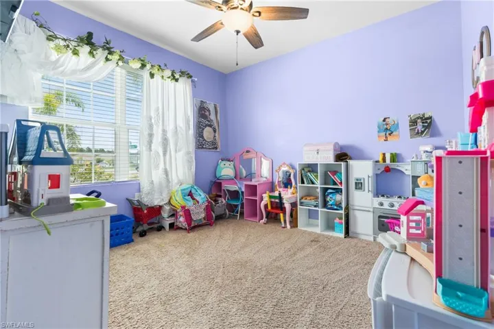Game room featuring ceiling fan and carpet flooring