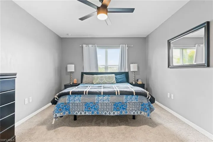 Bedroom with carpet and ceiling fan