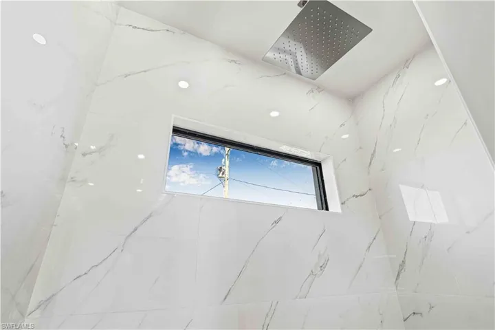 Bathroom view of a marble finish shower