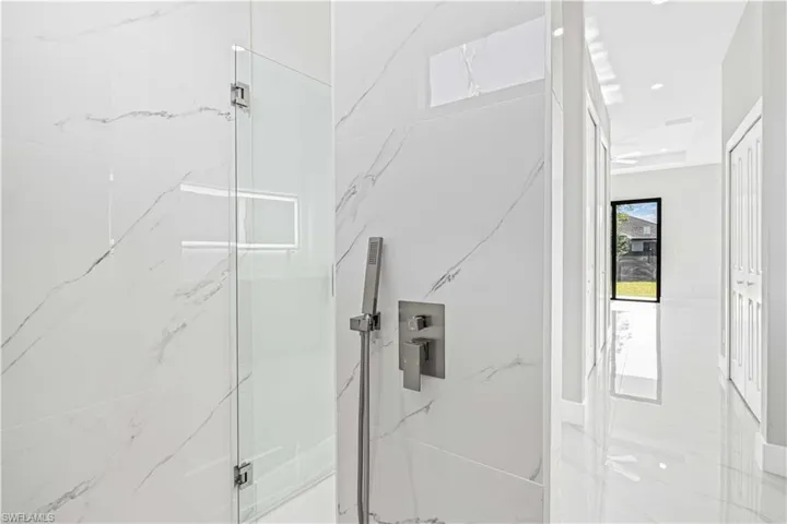 Primary bathroom shower with rain shower