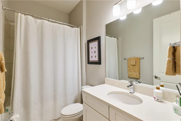 Bathroom featuring vanity and shower / tub combo