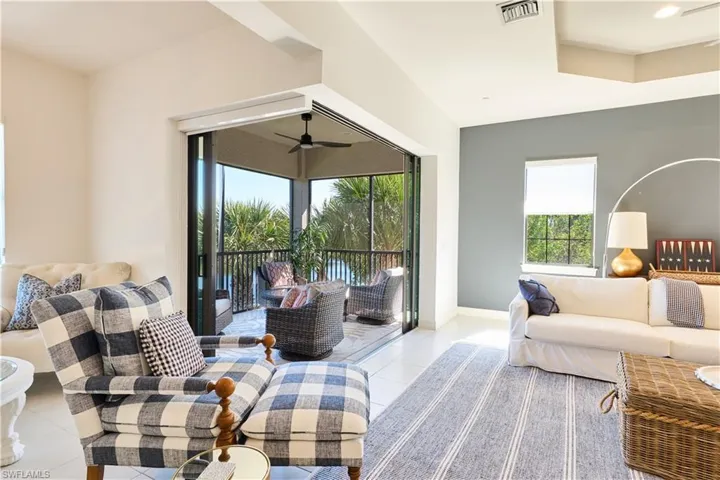 Living area with plenty of natural light and light tile patterned flooring