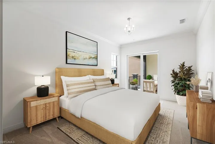 Carpeted bedroom featuring crown molding and an inviting chandelier