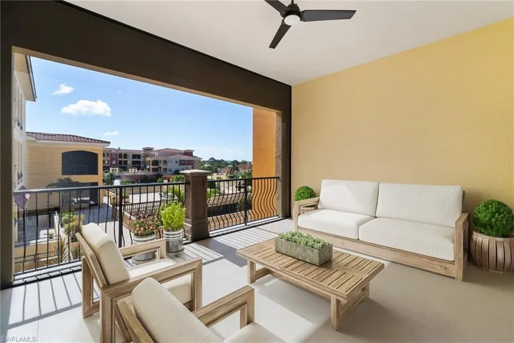 Balcony featuring an outdoor living space and ceiling fan