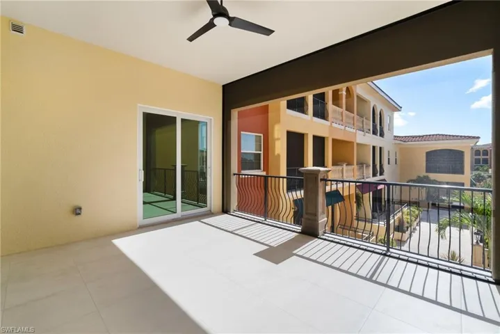 View of patio / terrace featuring a balcony and ceiling fan