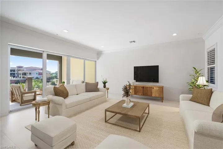 Tiled living room featuring crown molding