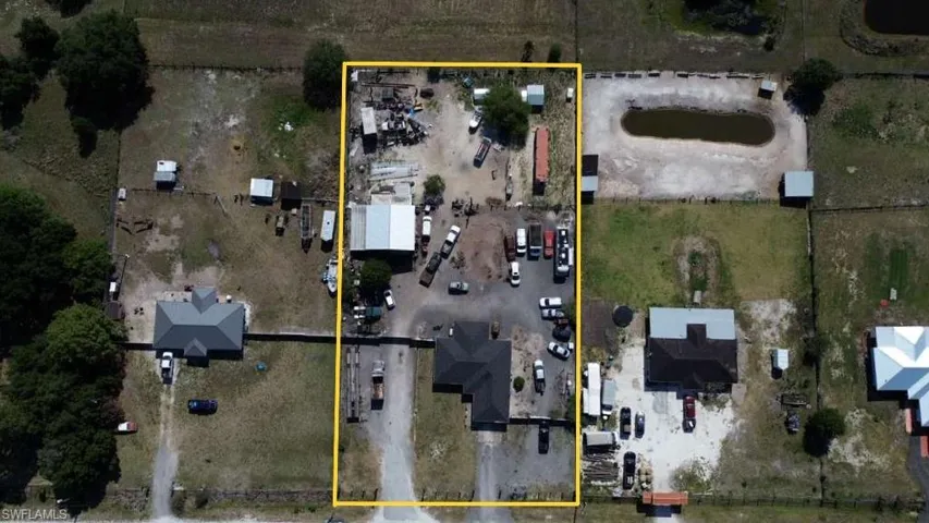 Aerial perspective showcasing a large residential property with multiple structures