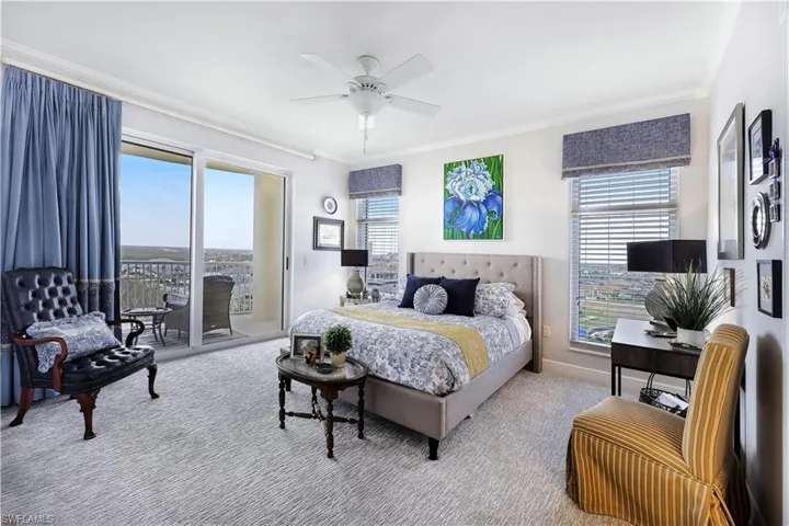 Bedroom featuring ornamental molding, carpet floors, access to outside, and a ceiling fan