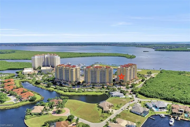 Aerial view of property's location featuring apartment complex