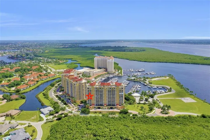 Aerial view of a nearby body of water and a marina