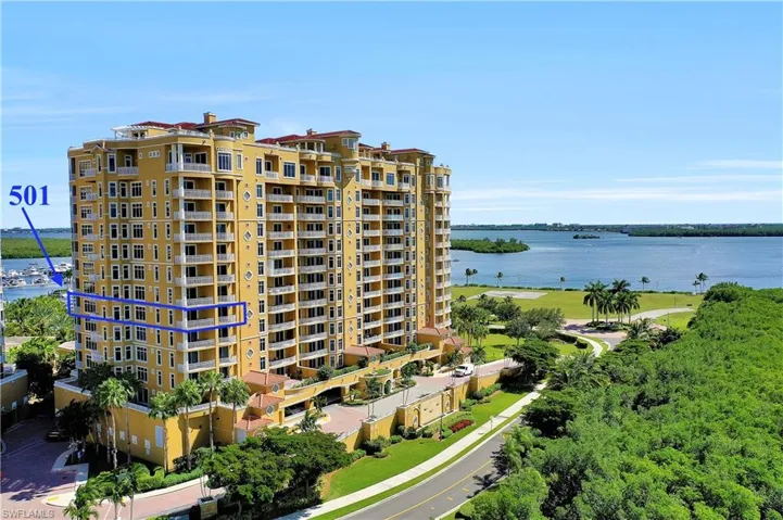 View of apartment building / complex with a water view