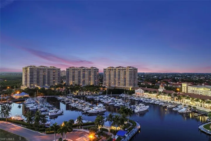 Water view with a marina and nearby urban area
