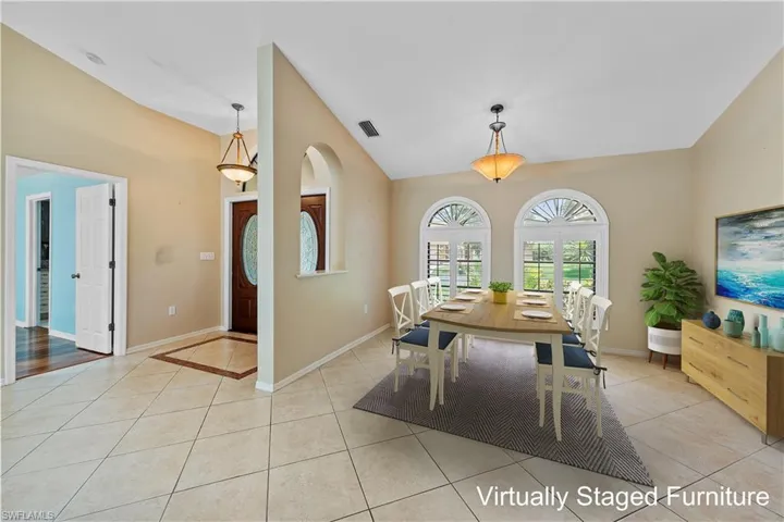 Dining and Entry area - furniture has been virtually staged
