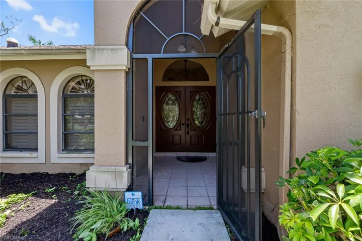 Screened front entrance with french doors