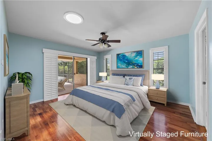 Unfurnished Master Bedroom with a wealth of natural light, ceiling fan, and hardwood / wood-style floors - furniture has been virtually staged
