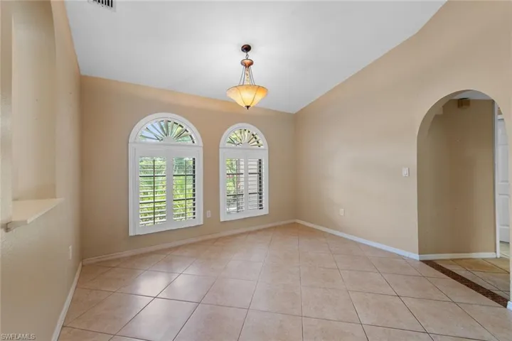 Formal Dining Room featuring vaulted ceiling
