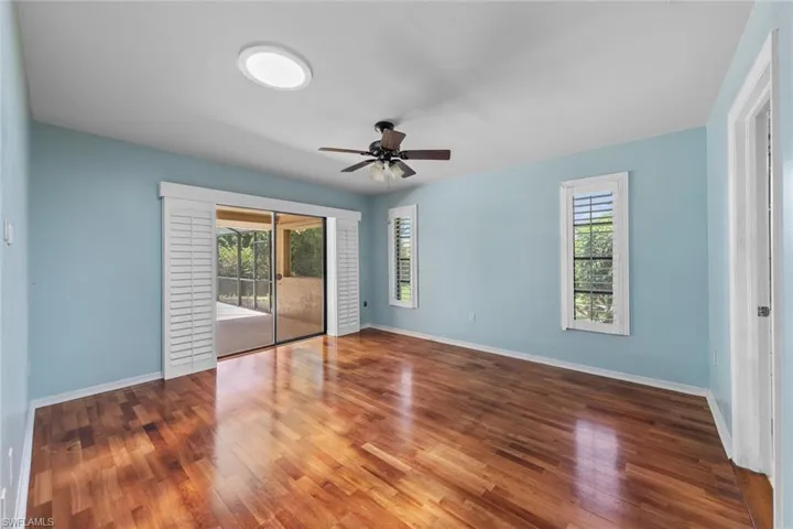 Unfurnished Master Bedroom with a wealth of natural light, ceiling fan, and hardwood / wood-style floors