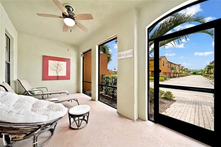 Sunroom / solarium featuring ceiling fan
