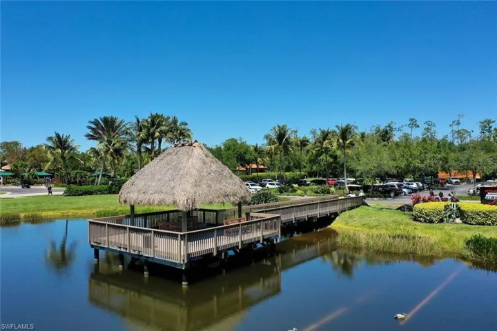 View of dock featuring a gazebo and a water view