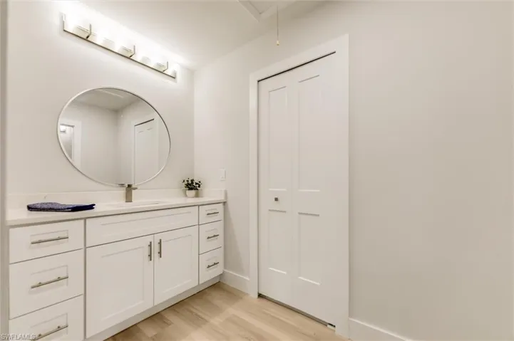 Bathroom with vanity and hardwood / wood-style floors
