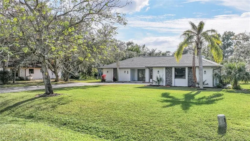 Ranch-style home with a front yard