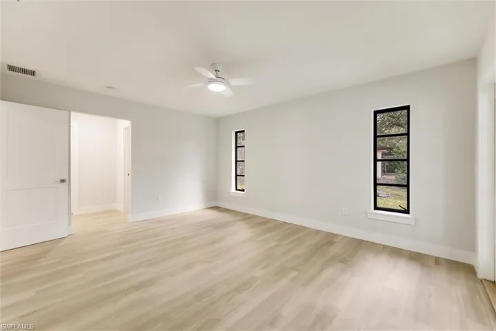 Unfurnished room featuring ceiling fan and light hardwood / wood-style floors