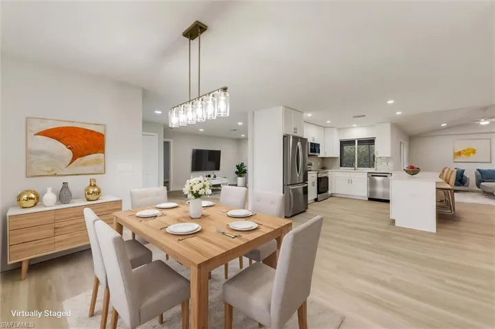 Virtually staged Dining room featuring light hardwood / wood-style flooring