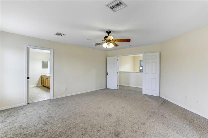 Large main bedroom with double entry doors.