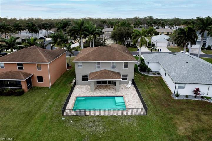 Large yard, spacious, fenced and pavered pool area!