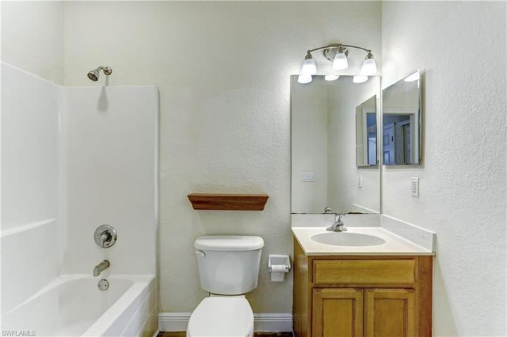 1st floor guest bathroom complete with tub/shower.