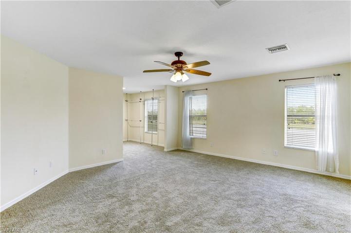 Main bedroom with lake views and huge additional room attached with has been made into a large closet! Could be used as another office or as a place for infant to sleep, etc. But, the best use of space is the closet!!! (this additional space is not counted as another bedroom)