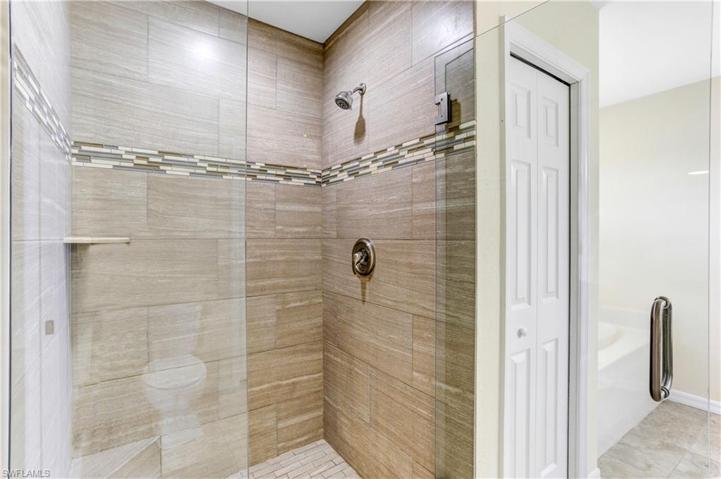 New Custom tiled shower in main bath with Glass shower doors.