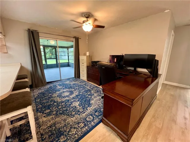 Dining room featuring ceiling fan and luxury vinyl plank flooring