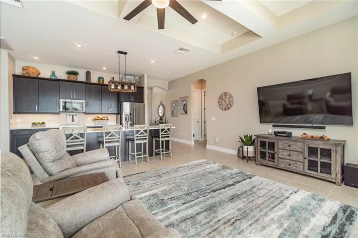 Tiled living room with ceiling fan