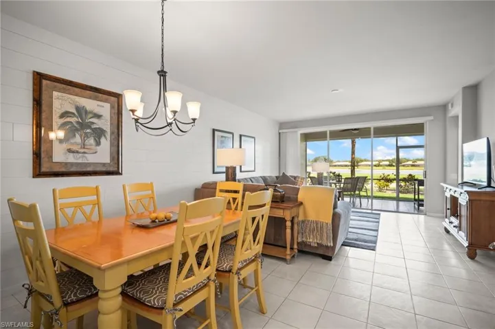 Dining space with a chandelier and light tile patterned floors