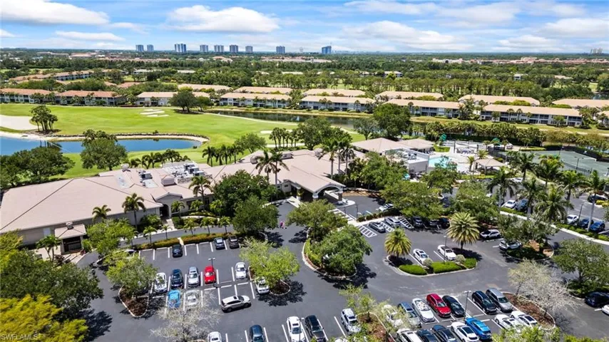 Aerial view of a golf course and a nearby body of water