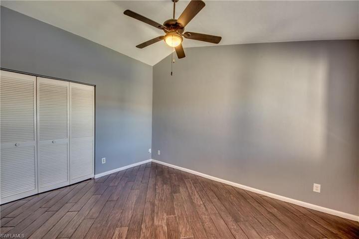 Den/Family Room off Kitchen with Double Window & Views of Lake and Fountain, Wood Look Tile Flooring.