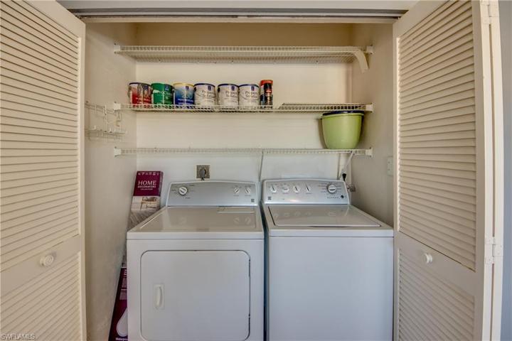 Inside Laundry Closet with Doors and shelving.