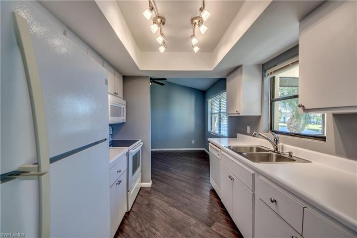 Galley Style Kitchen with coved lighting & a great Lake & Fountain View from the window!