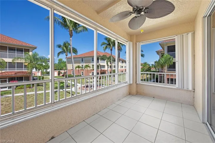 Unfurnished sunroom featuring tile patterned flooring