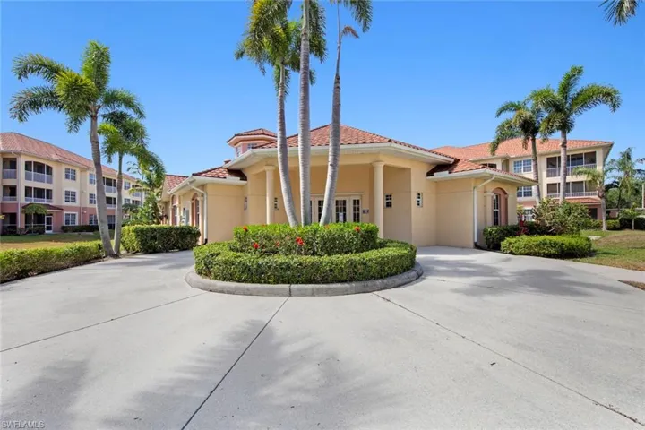 View of front of home featuring stucco siding and a tiled roof