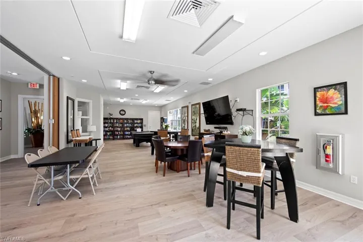 Dining space featuring a ceiling fan, recessed lighting, light wood-style floors, and visible vents